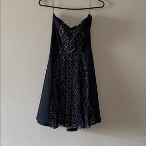 A black and gold strapless dress